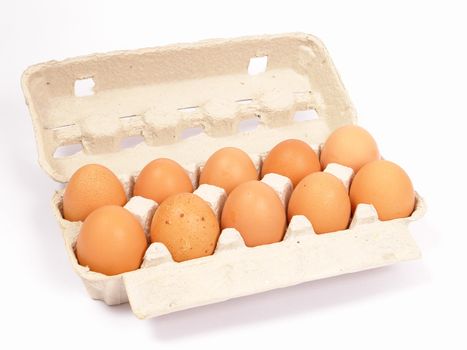  10  brown eggs in cardboard container                           