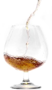 Pouring cognac into a Glass.                               