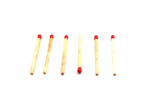 Some red matches isolated on a white background.