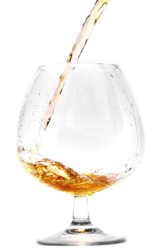 Pouring cognac into a Glass.                               