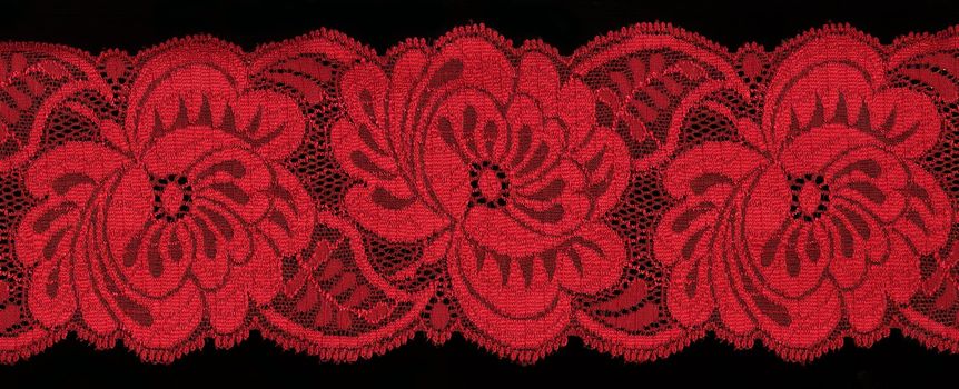 red  lace on black background                             