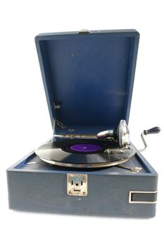  The device for playing phonograph records over white background.                            