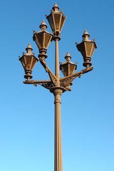 Street lamp on a background of blue sky                               