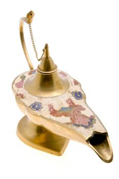 An old brass oil lamp on white background