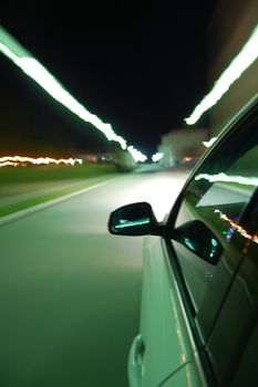 night drive with car in motion through the city shows the speed