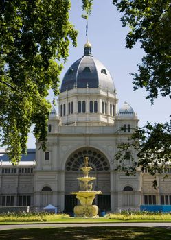 Melbourne royal exhibition hall, main entrance with fountain and dome. View from the park.