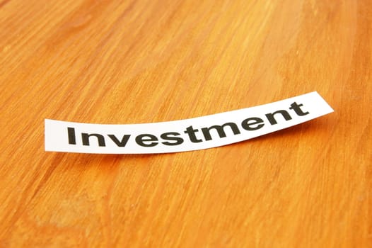 word investment written on paper and space for text message