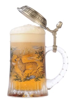 Souvenir glass with the image of the wild nature, filled by beer, with the slightly opened cover