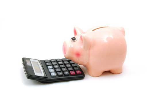 piggy bank and calculator showing saving concept
