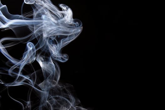 abstract smoke background or smoking concept on black