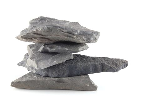 A tower made of stones isolated on a white background.