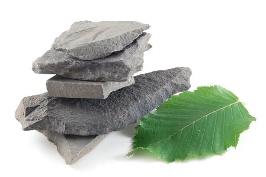 A tower made of stones isolated on a white background.