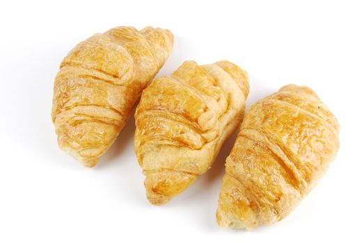 fresh croissants isolated on white background