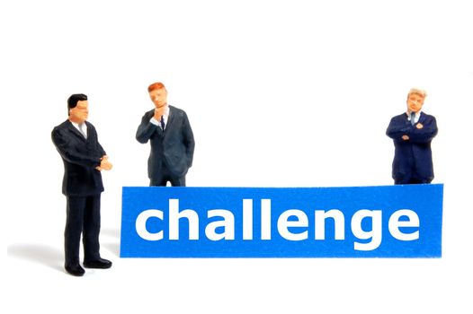 business challenge with small toy man isolated on white