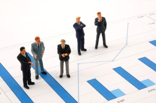 business man over economic chart in conversation
