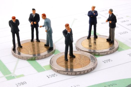 successful businessman and euro money over business chart
