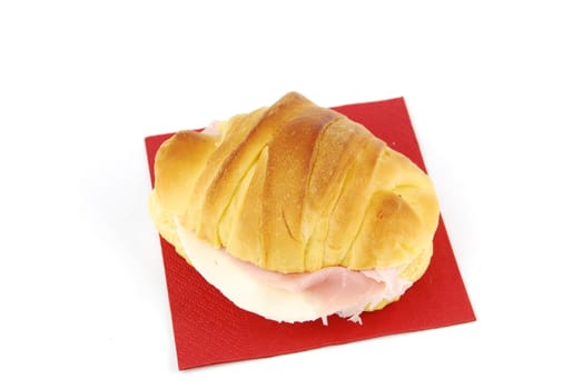 cheese and ham fresh croissant with red napkin isolated on white background