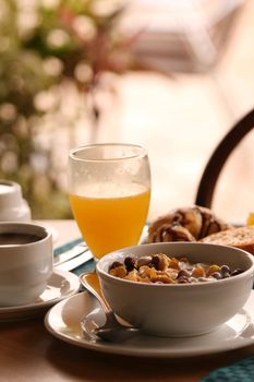 Breakfast with cup coffee, orange juice and cereals in hotel