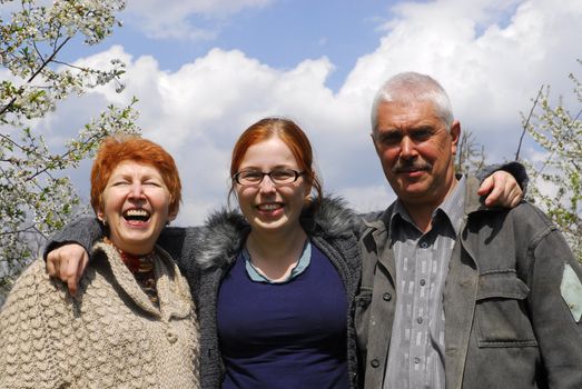 Senior couple with daughter on the nature 