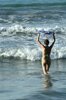 Bikini girl with boogie board