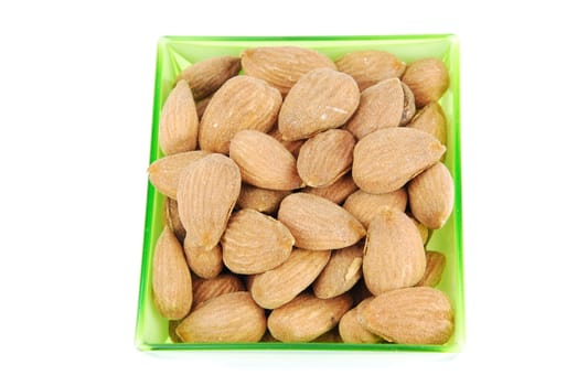 almond nuts on a cup isolated on white background