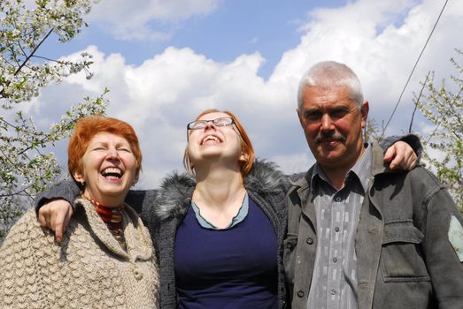 Senior couple with daughter on the nature 3