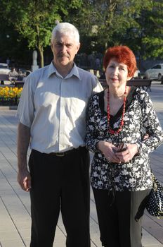 A happy senior couple outdoors. They are still in love after many years together.