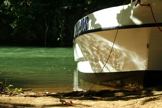 old motor boat on tropical beach