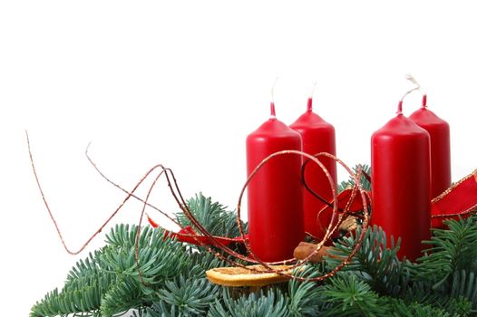 christmas wreath isolated on white background with red candles