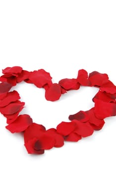 beaufiful red heart made of rose petals (isolated on white background)