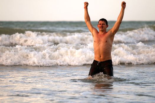 happy man cheering after swimming