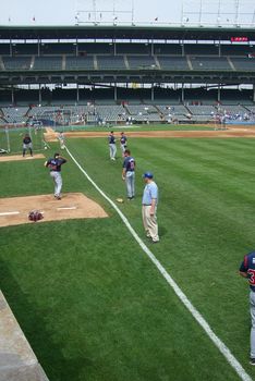 Atlanta Braves pitchers warm up for daytime baseball in the city of Chicago