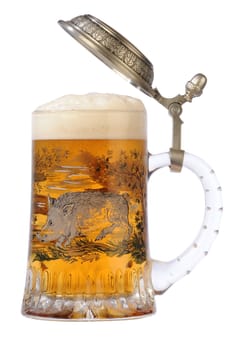 Souvenir glass with the image of the wild nature, filled by beer, with the slightly opened cover