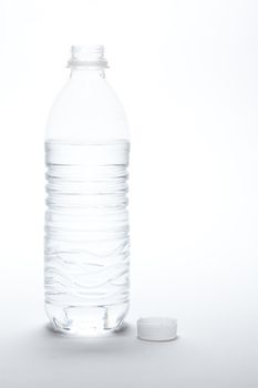 Water Bottle and Cap Image on A Gradated White Background.