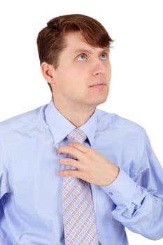 A man adjusts blue tie isolated on white background