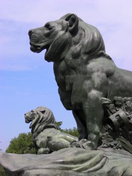 Two lions statues close to the Retiro's Lake in Madrid.