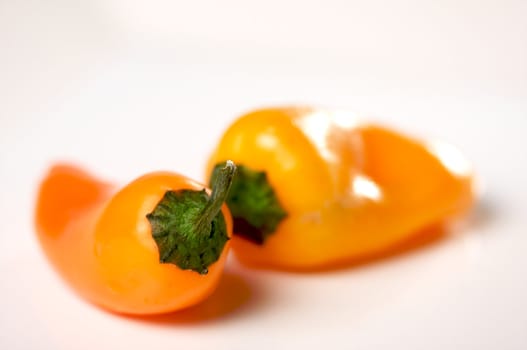 Sweet Orange Peppers on a white background.