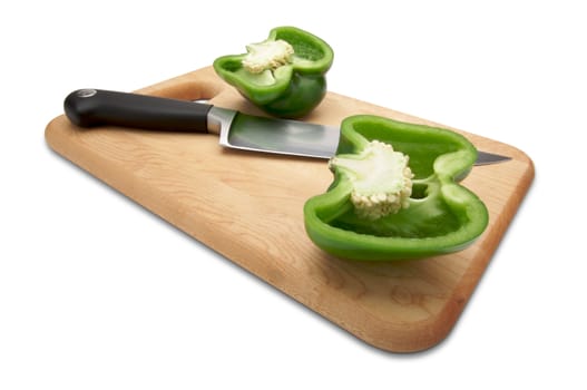 Cut Green Bell Pepper and Knife on a Wood Cutting Board