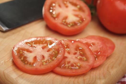 Fresh Cut Tomato on a Cutting Board