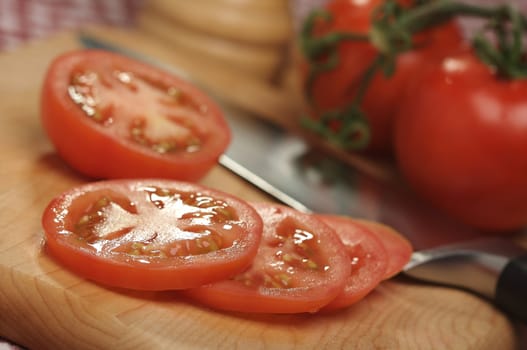 Fresh Cut Tomato on a Cutting Board