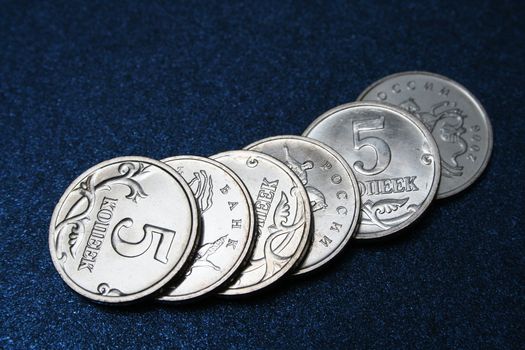 The Russian coins on darkly dark blue background 