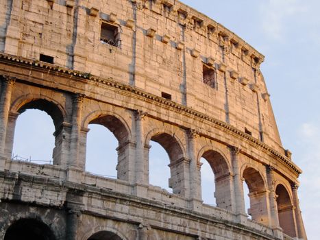 Upper detail of the roman colosseum in the sunset light