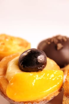 Close-up of some mixed delicious tea cakes with copy space