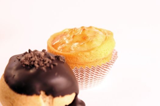 Close-up of some mixed delicious tea cakes isolated on white