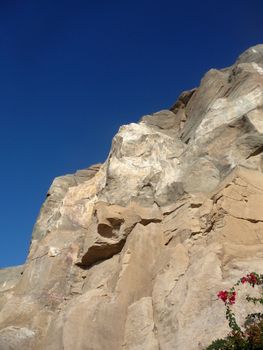 A view of some rocky cliffs with a sky background.