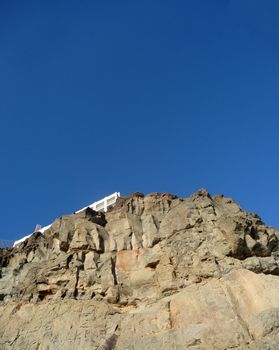A view of some rocky cliffs with a sky background
