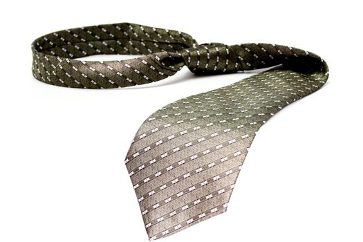 Tie of the businessman of grey color with a simple pattern, isolated on white, (look similar images in my portfolio)