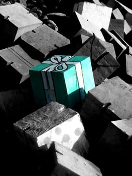 A cube of concrete that looks like a present.