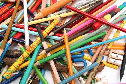 Collection of multi-colour wooden pencils and wooden sharpener