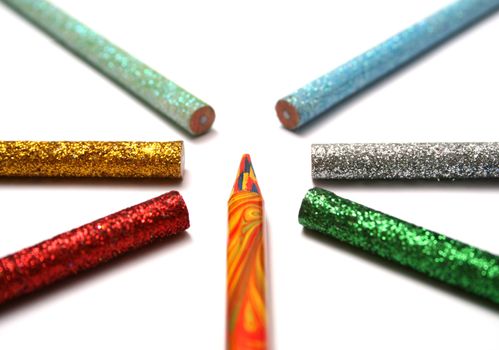 The multi-colour pencil is surrounded by brilliant color pencils from above macro